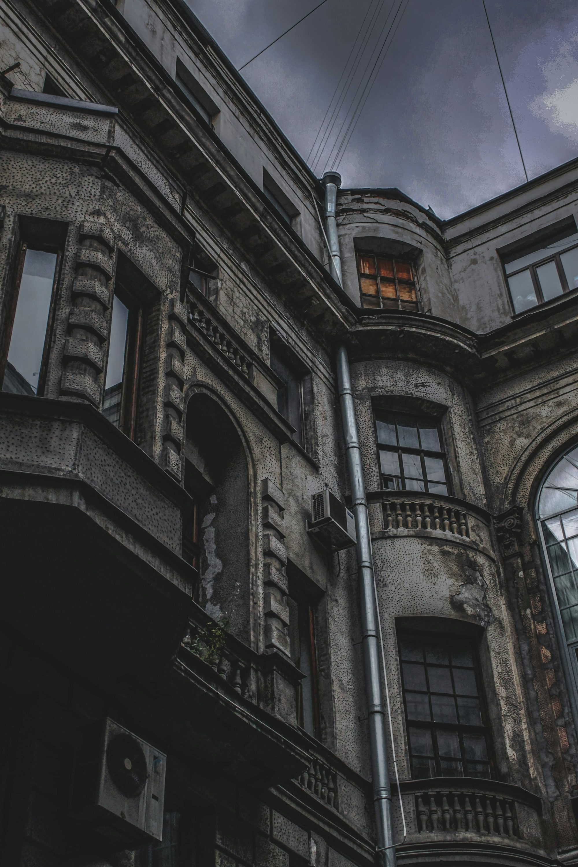 an old building with many windows and balconies